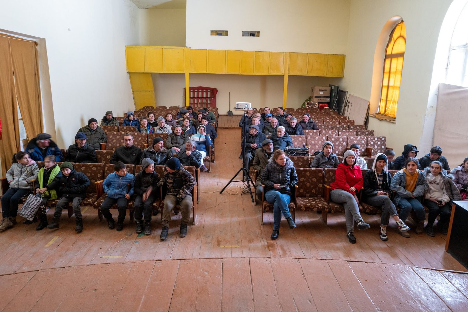 The community hall filled with families for the screening
